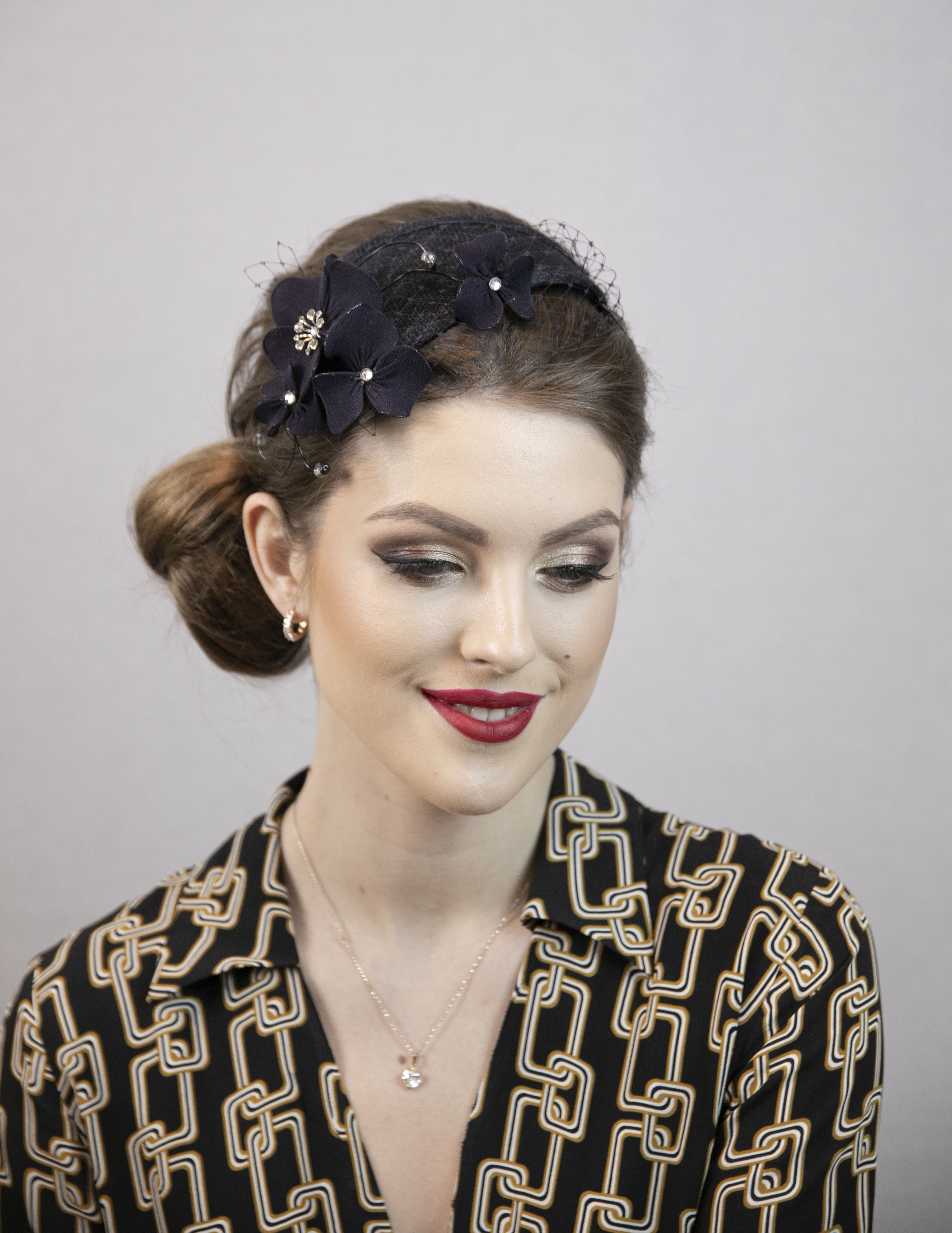 Blue floral fascinator. Dark blue wedding hat.