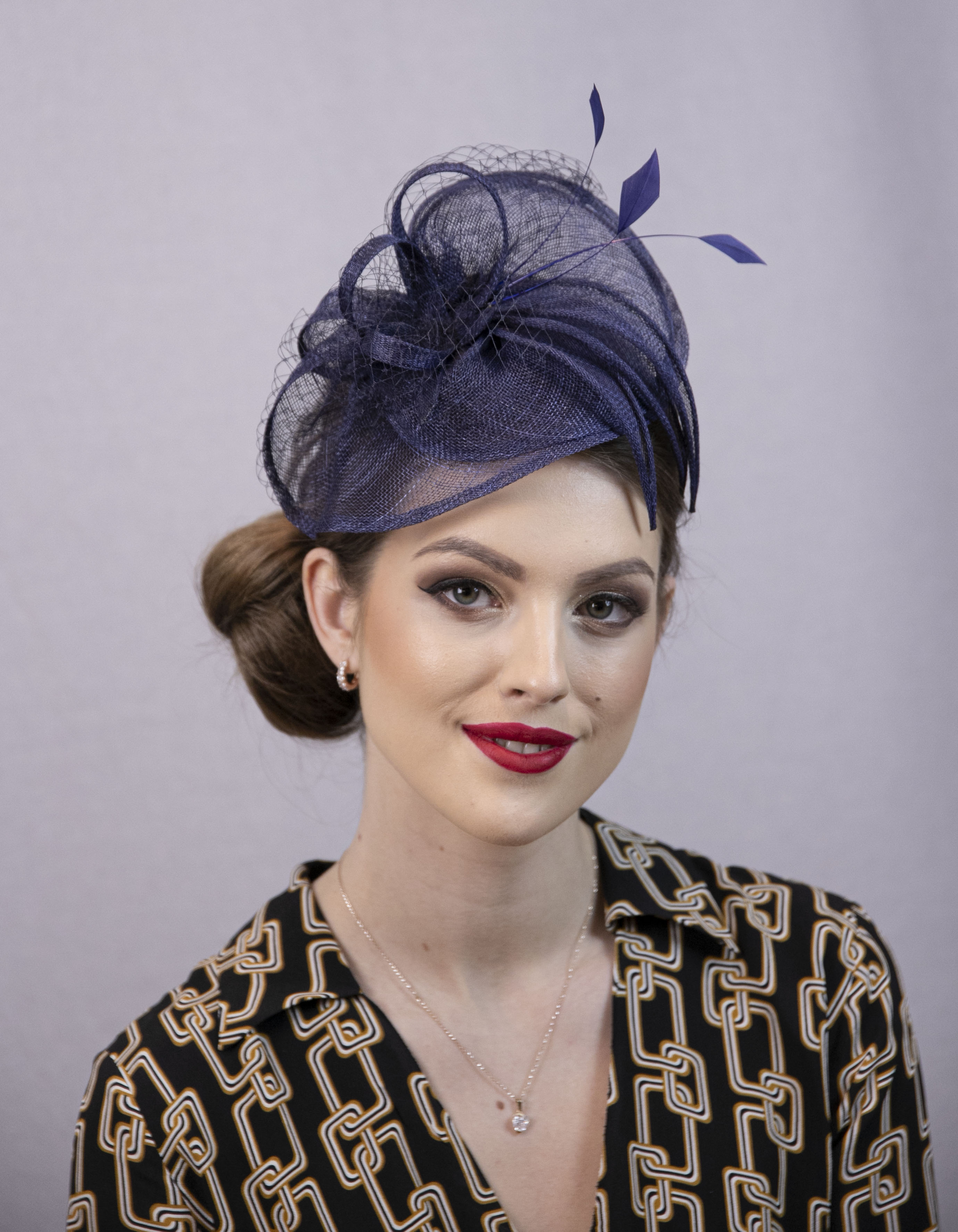 Blue fascinator hat.