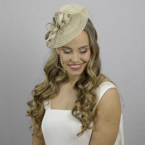 Golden fascinator hat.