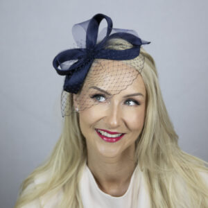 Blue fascinator with veil.