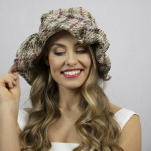 Glamorous casual wide brim designer hat with playful brim.