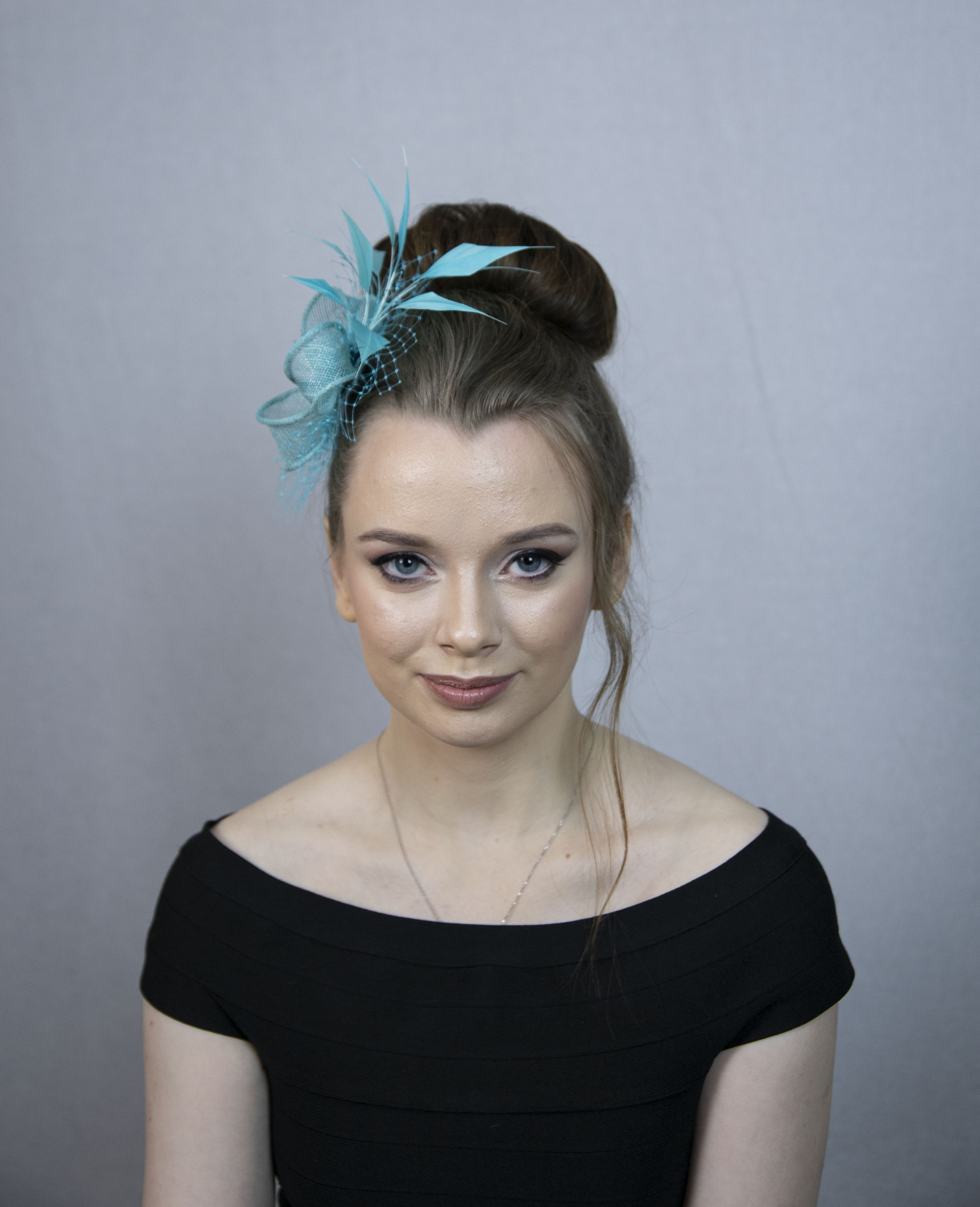 Turquoise feather fascinator