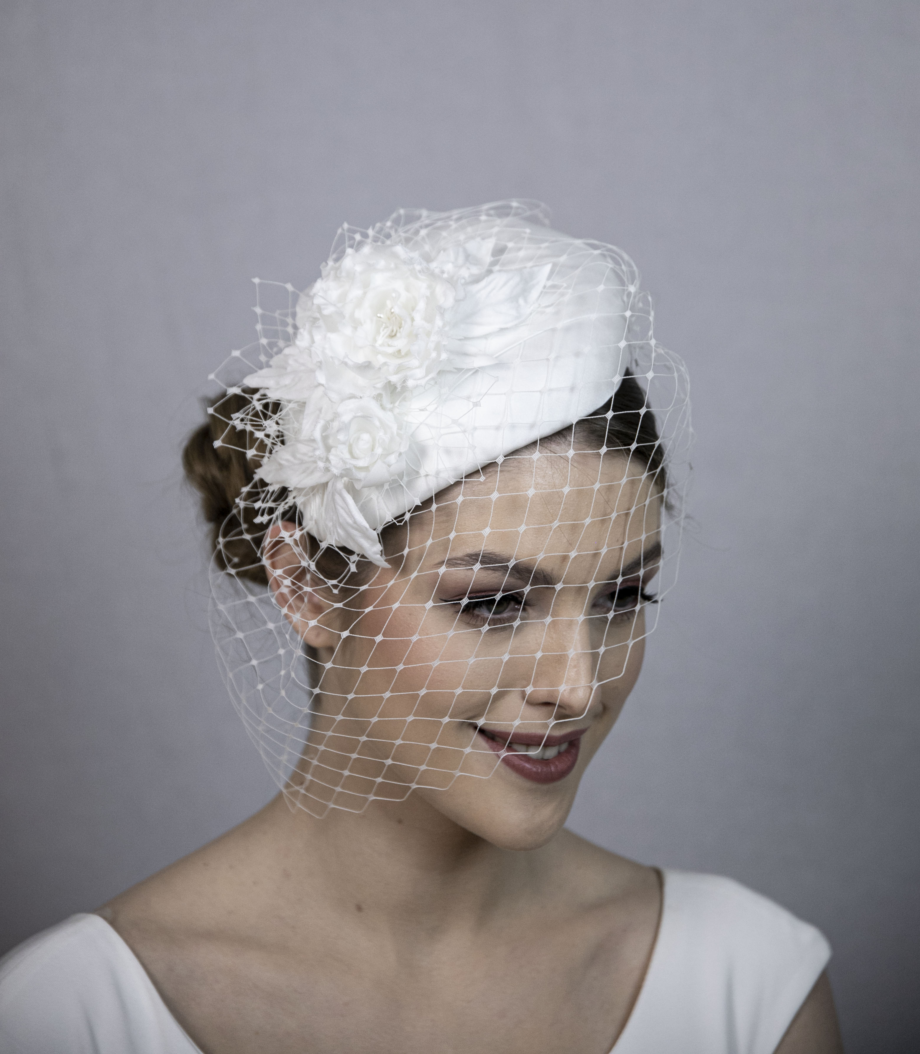 White silk wedding hat. White bridal hat with veil.