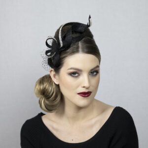 Black fascinator with silver rhinestones.