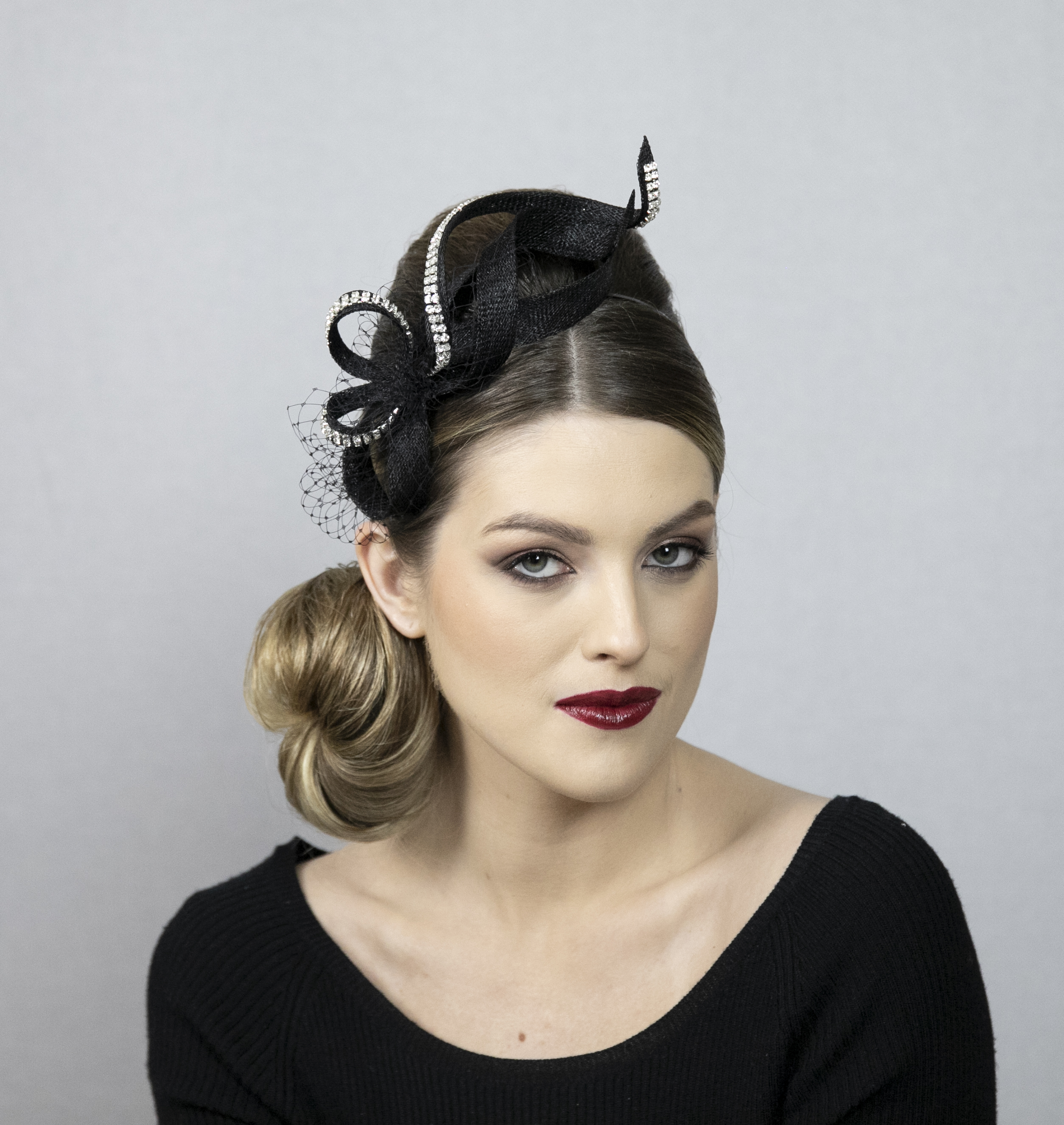 Black fascinator with silver rhinestones.