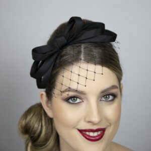 Black fascinator with short net. Very popular design!