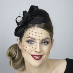 Black classical fascinator with face veil.