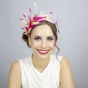 Pink and beige feather fascinator.