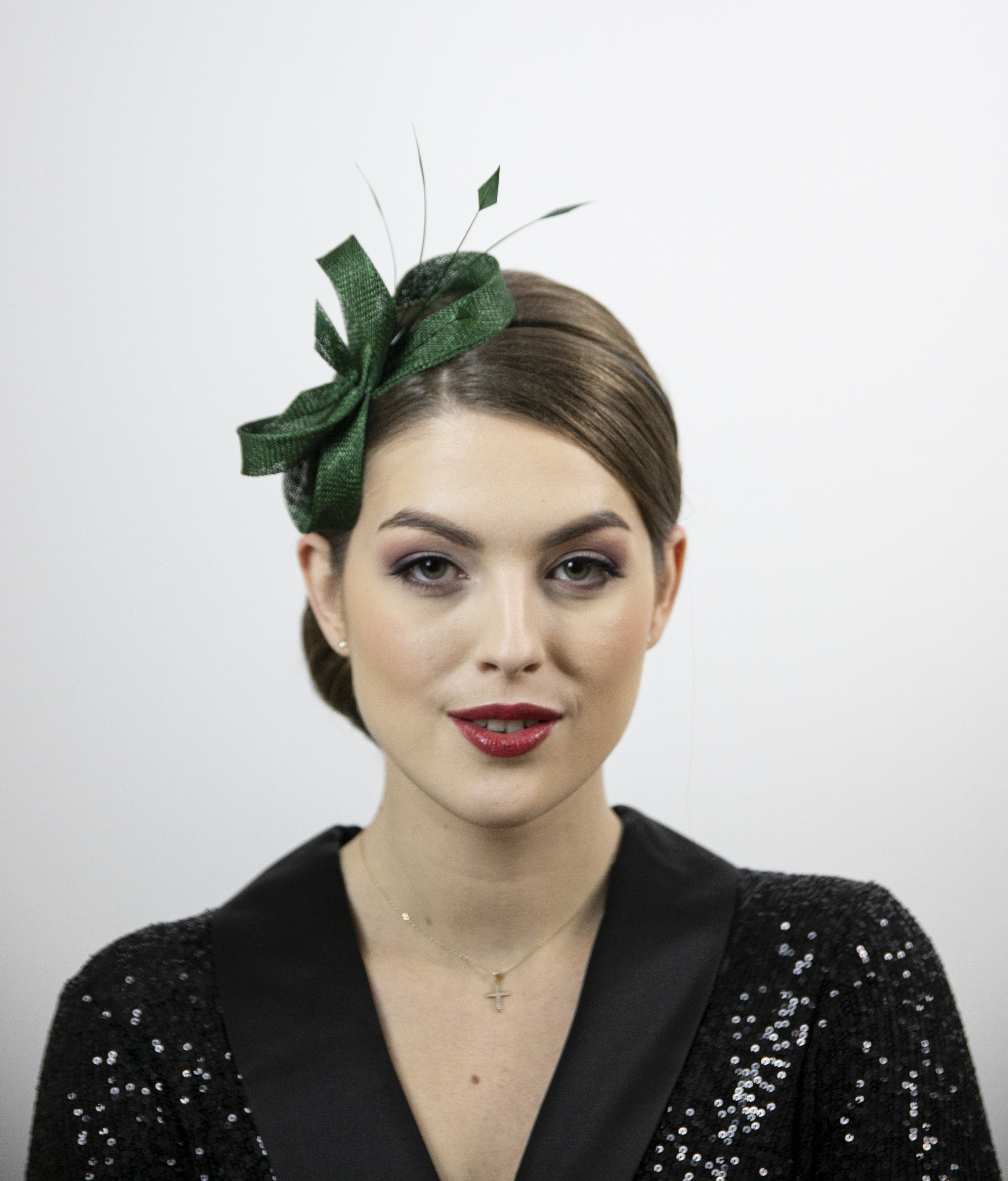 Green fascinator with feathers. Christmas fascinator.