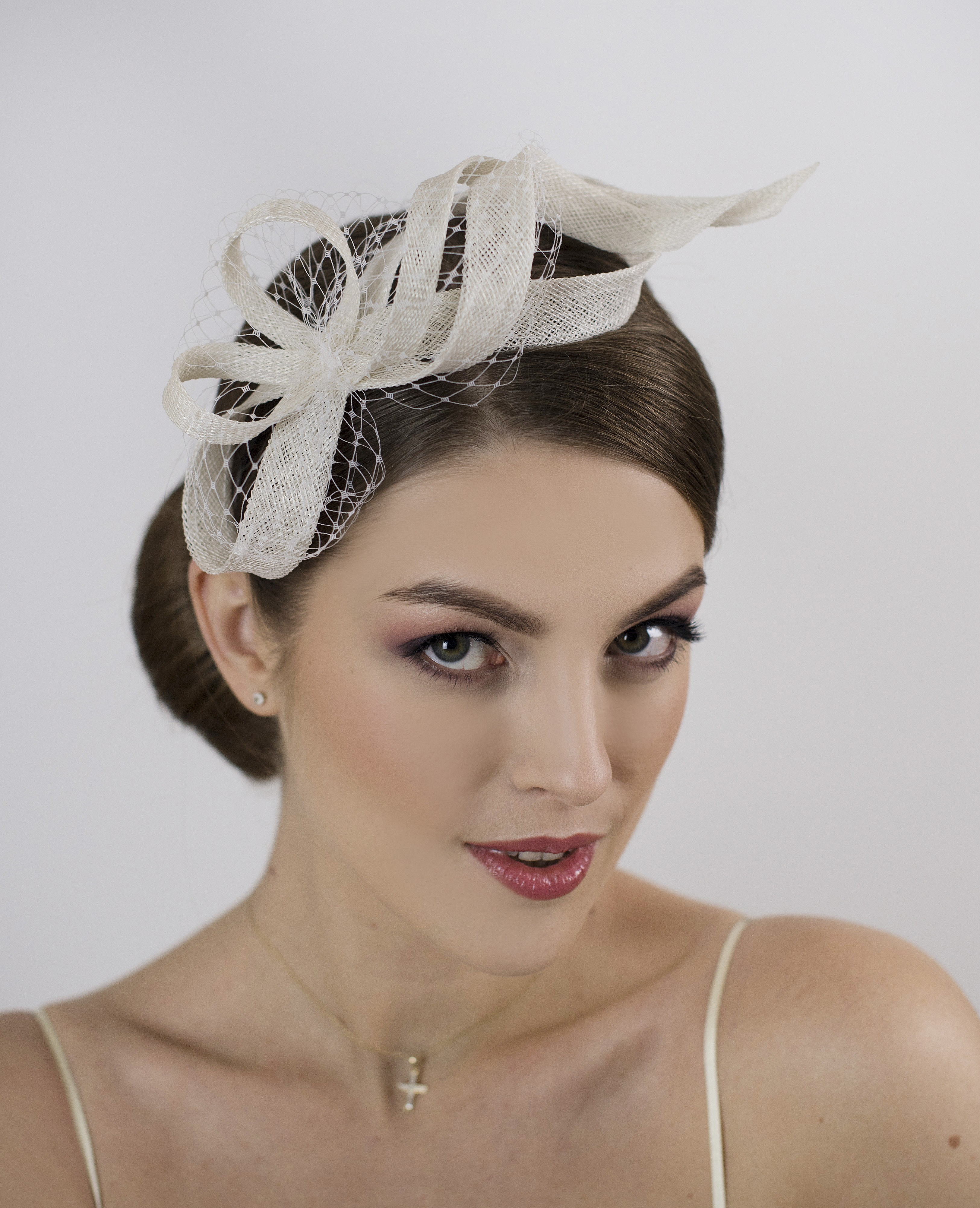 White modern and minimalist wedding fascinator.