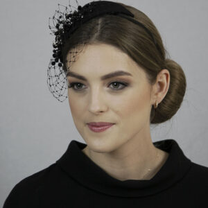 Black fascinator hat with veil. Black funeral headpiece.