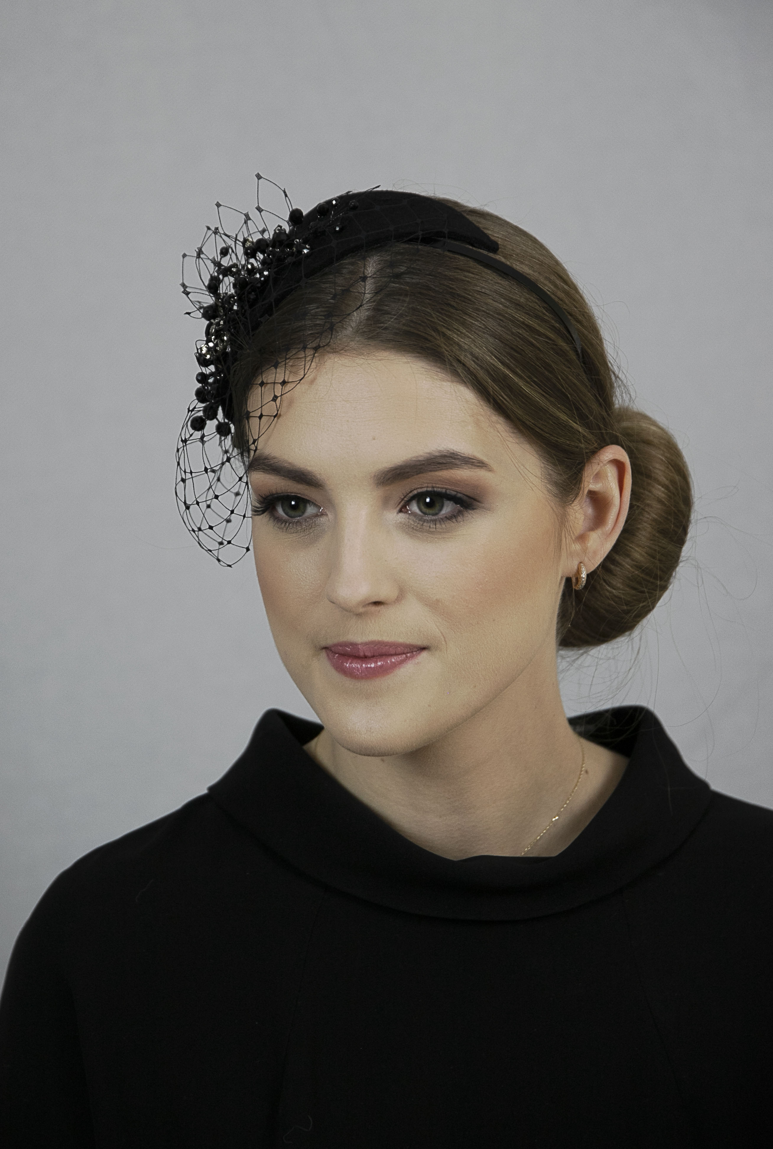 Black fascinator hat with veil. Black funeral headpiece.