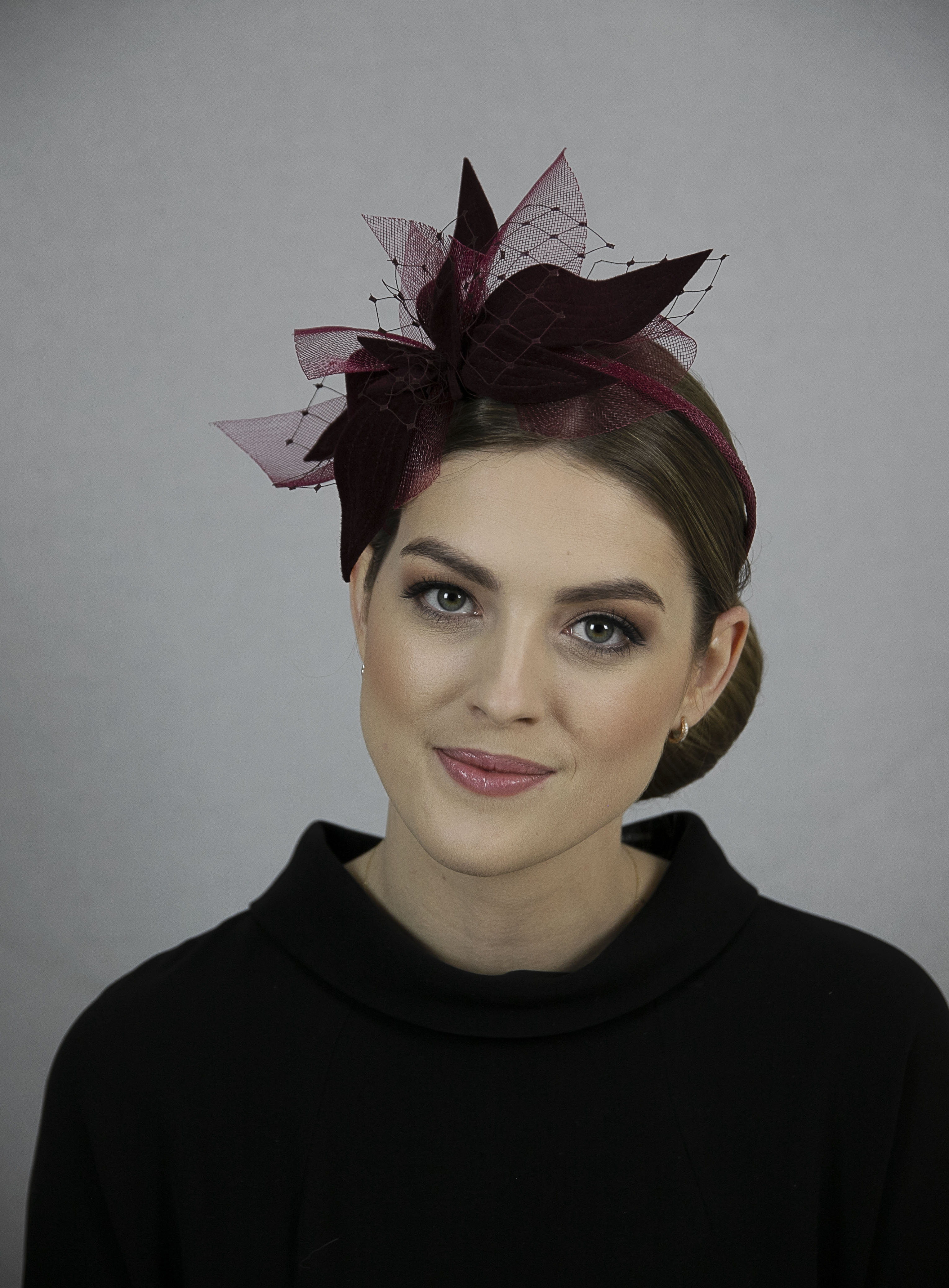 Burgundy red fascinator.